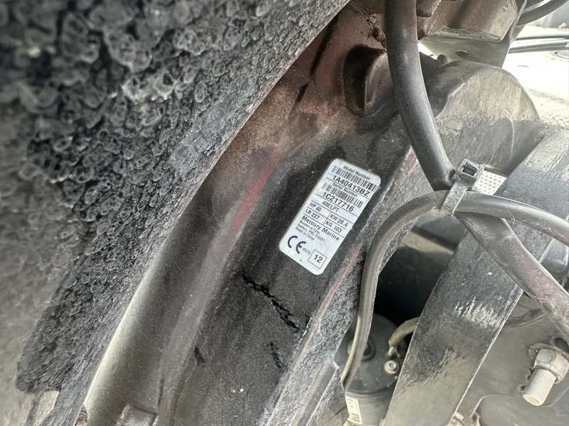 Slide: The Image of 2013 Tracker Super Guide V-16 SC boat engine label with model and specifications. - 5