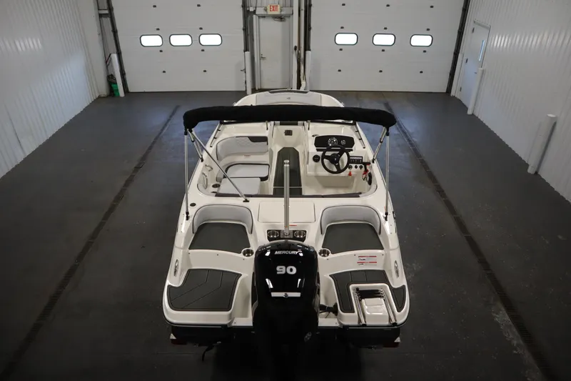 Slide: The Image of 2025 Bayliner M17 ELEMENT MX COMFORT boat in indoor storage, rear view. - 11