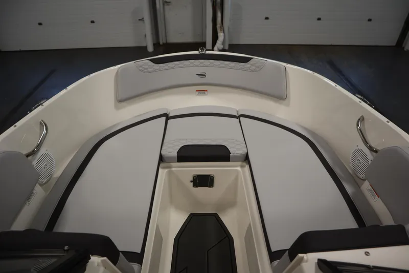 Slide: The Image of 2025 Bayliner M17 ELEMENT MX COMFORT boat interior with cushioned seating. - 12