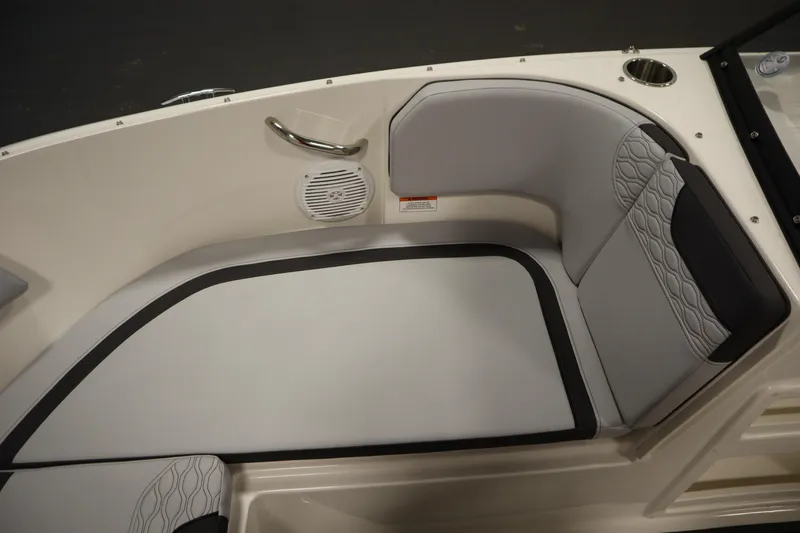 Slide: The Image of 2025 Bayliner M17 ELEMENT MX COMFORT boat interior seating with speaker and cup holder. - 14