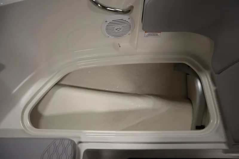 Slide: The Image of 2025 Bayliner M17 ELEMENT MX COMFORT boat storage compartment with speaker and handle. - 15