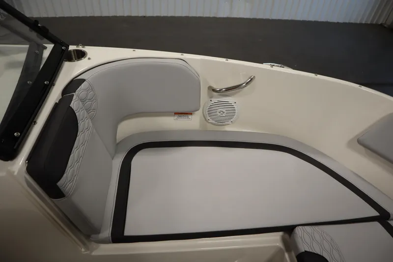 Slide: The Image of 2025 Bayliner M17 ELEMENT MX COMFORT boat interior with cushioned seating and speaker. - 16