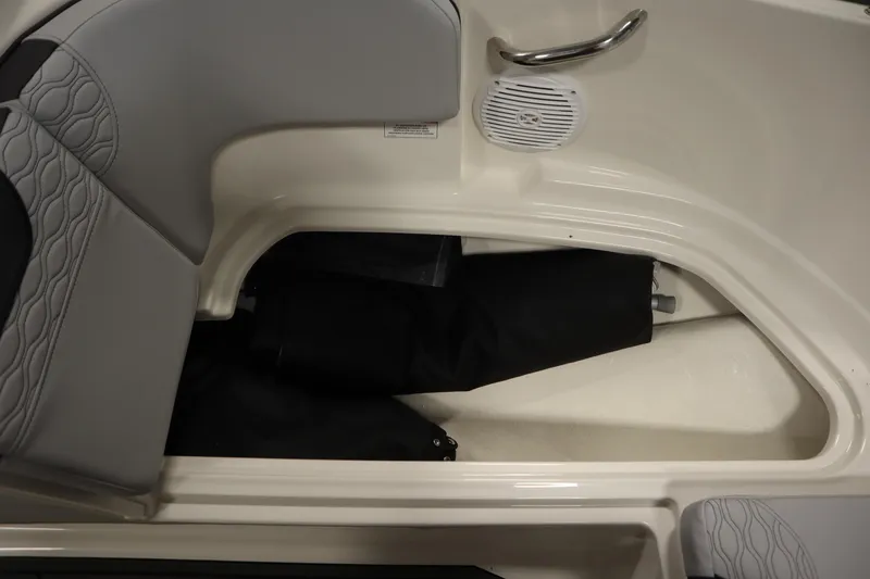 Slide: The Image of 2025 Bayliner M17 ELEMENT MX COMFORT boat interior with storage compartment and speaker. - 17