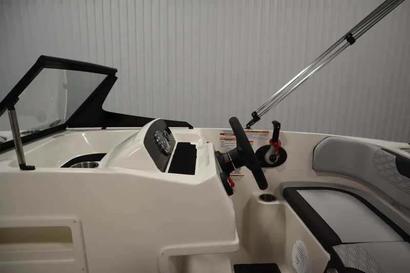 Slide: The Image of 2025 Bayliner M17 ELEMENT MX COMFORT boat interior with steering wheel and seating. - 19