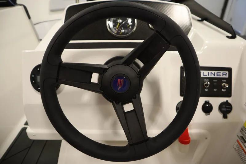 Slide: The Image of Steering wheel of 2025 Bayliner M17 ELEMENT MX COMFORT boat, featuring control panel. - 20