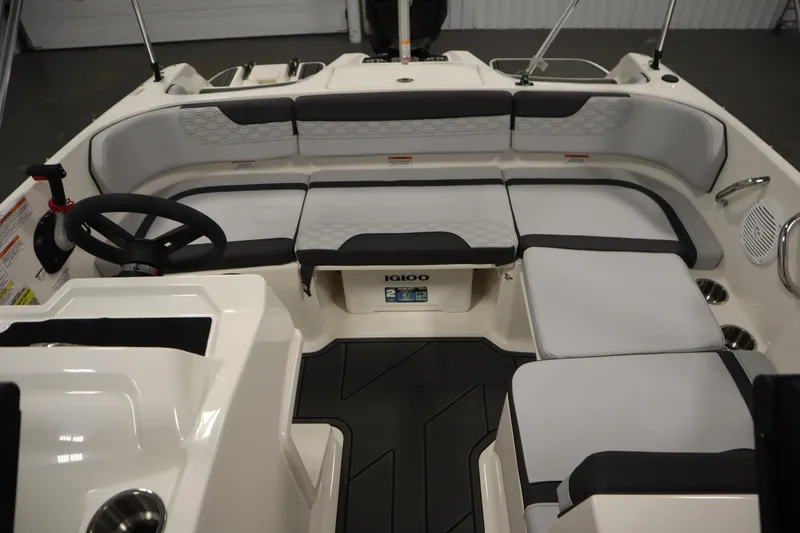Slide: The Image of 2025 Bayliner M17 ELEMENT MX COMFORT boat interior with cushioned seating and steering wheel. - 27