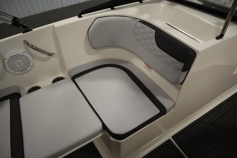 Slide: The Image of 2025 Bayliner M17 ELEMENT MX COMFORT boat interior with cushioned seating and speaker. - 28