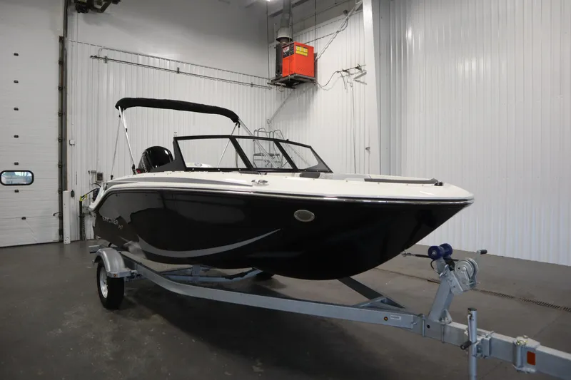 Slide: The Image of 2025 Bayliner M17 ELEMENT MX COMFORT boat on trailer in indoor storage. - 3