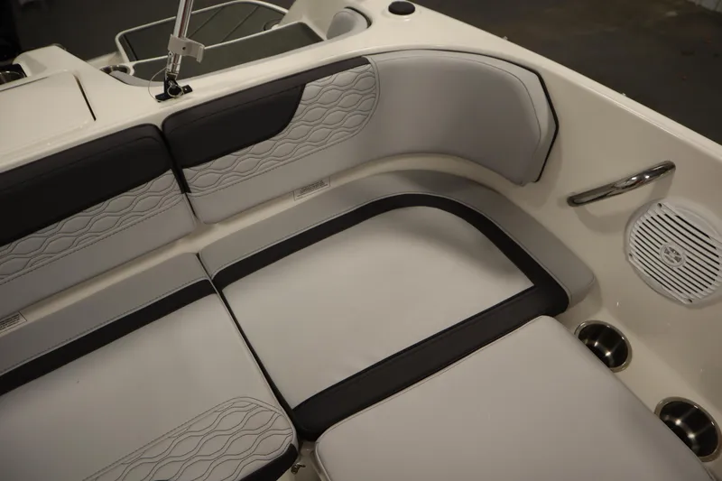 Slide: The Image of 2025 Bayliner M17 ELEMENT MX COMFORT boat interior with cushioned seating and speaker. - 30