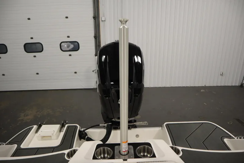 Slide: The Image of 2025 Bayliner M17 ELEMENT MX COMFORT boat interior with motor and cup holders. - 35