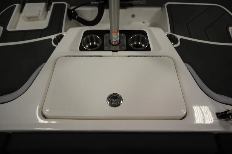 Slide: The Image of 2025 Bayliner M17 ELEMENT MX COMFORT boat interior with cup holders and storage compartment. - 36