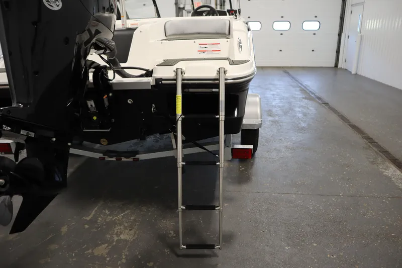 Slide: The Image of 2025 Bayliner M17 ELEMENT MX COMFORT boat with ladder in indoor garage. - 38