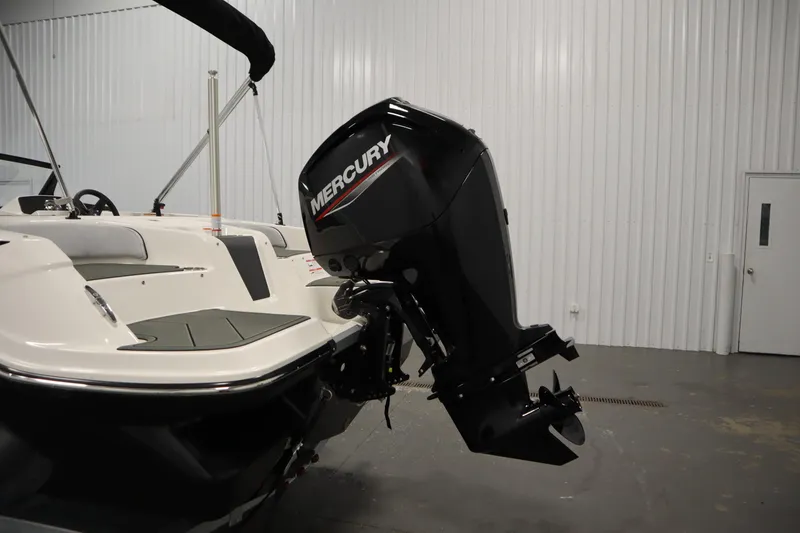 Slide: The Image of 2025 Bayliner M17 ELEMENT MX COMFORT boat with Mercury outboard motor in a showroom. - 39