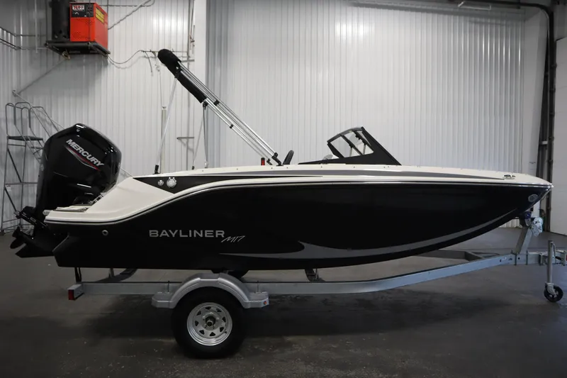 Slide: The Image of 2025 Bayliner M17 Element MX Comfort boat on trailer in indoor setting. - 5