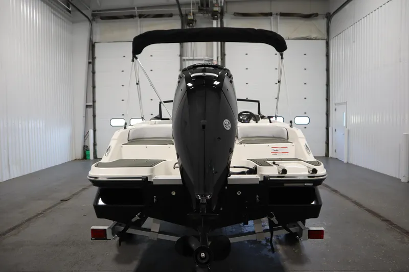Slide: The Image of 2025 Bayliner M17 ELEMENT MX COMFORT boat in a garage, rear view. - 7