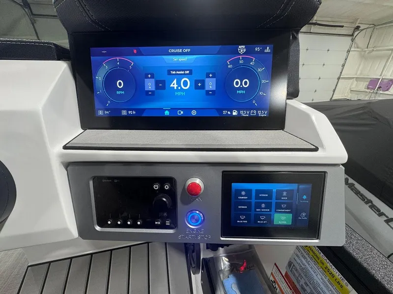 Slide: The Image of 2025 Montara Surf Boss boat interior with blue and white seating and cup holders. - 12