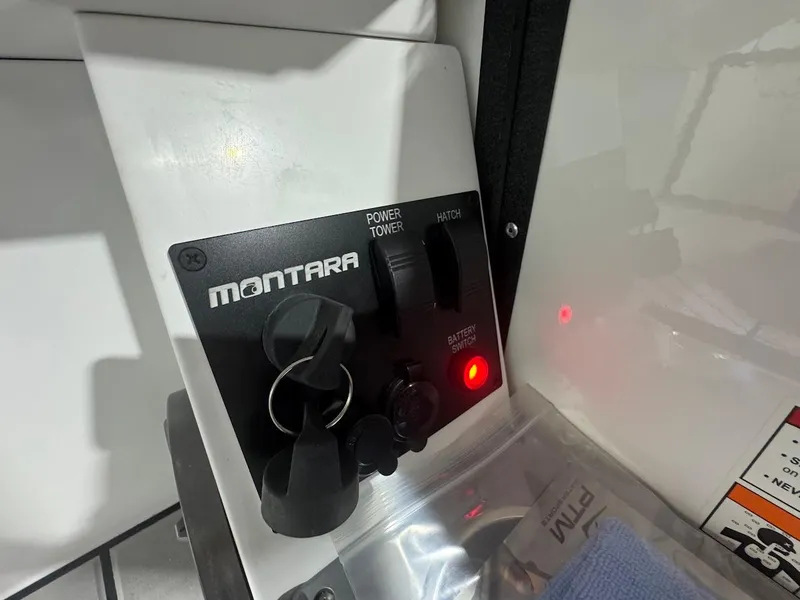 Slide: The Image of Luxurious interior of 2025 Montara Surf Boss boat with blue and beige seating. - 13