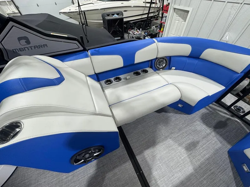 Slide: The Image of 2025 Montara Surf Boss interior with speakers and blue seating in showroom. - 16
