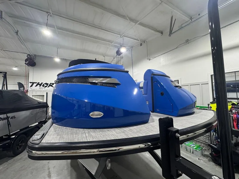 Slide: The Image of 2025 Montara Surf Boss boat on trailer in indoor showroom. - 6