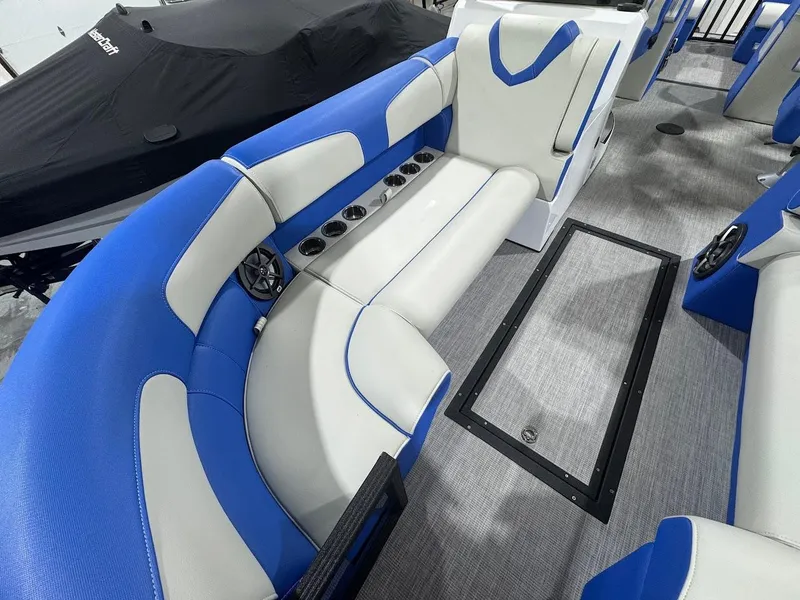 Slide: The Image of 2025 Montara Surf Boss boat interior with seating and speakers in showroom. - 8