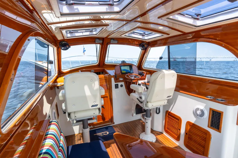 Slide: The Image of Interior of 2007 Hinckley Picnic Boat EP with wooden finish and ocean view. - 26