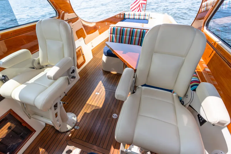 Slide: The Image of Luxurious interior of 2007 Hinckley Picnic Boat EP with leather seats and wooden flooring. - 31