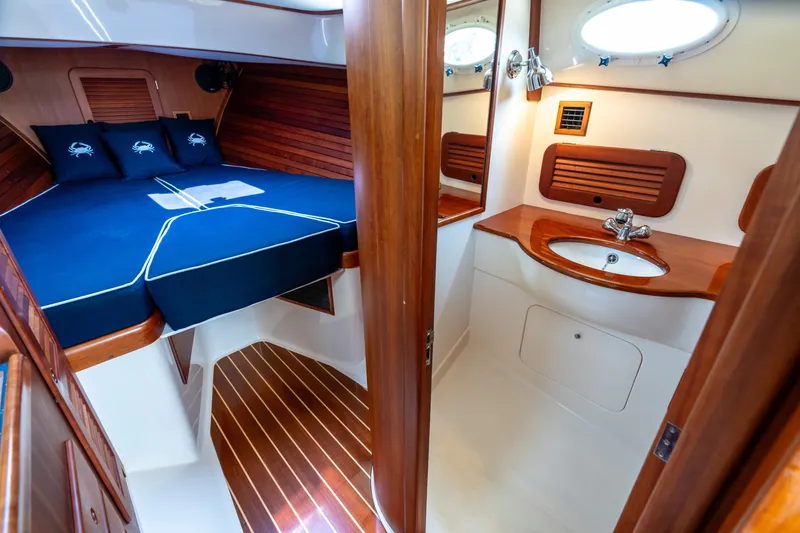 Slide: The Image of Luxurious 2007 Hinckley Picnic Boat EP interior with cozy cabin and elegant wood finishes. - 38