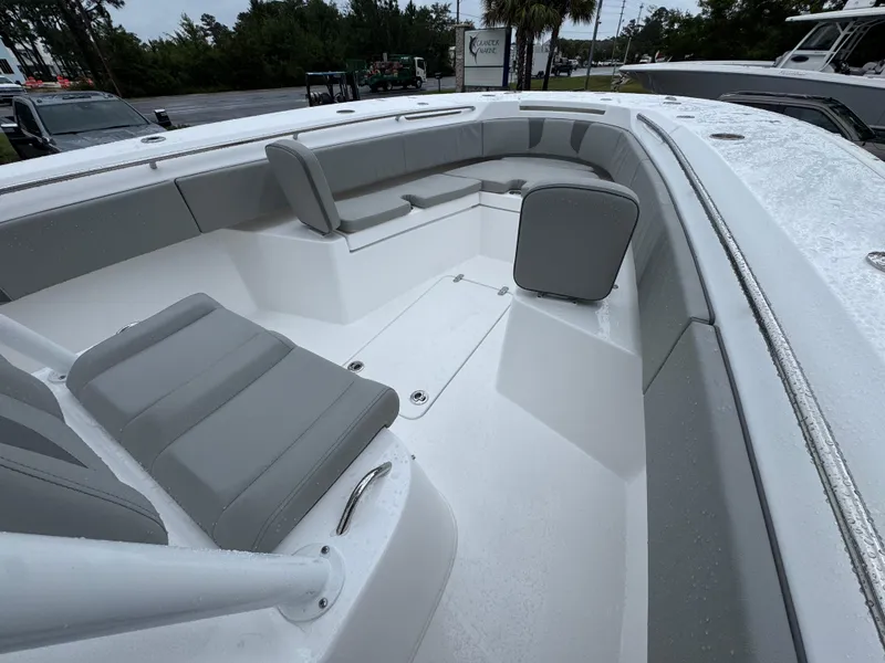 Slide: The Image of 2025 Cape Horn 32 XS boat interior with gray seating and sleek design. - 17