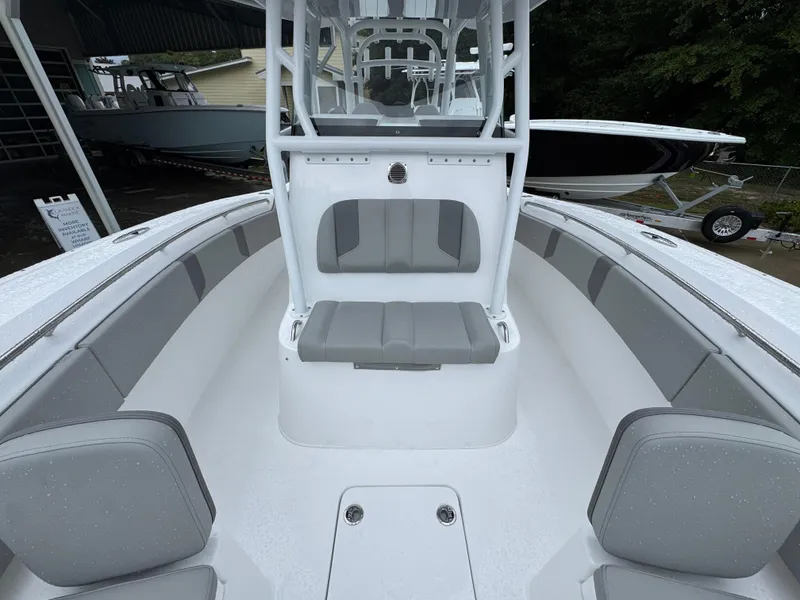 Slide: The Image of 2025 Cape Horn 32 XS boat interior with gray seating and white deck. - 23