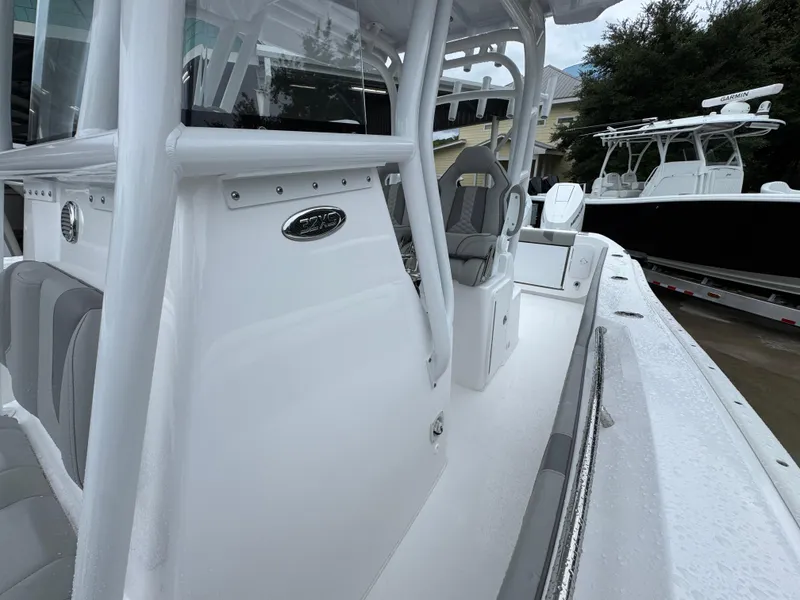 Slide: The Image of 2025 Cape Horn 32 XS boat, sleek white design, spacious seating, modern features. - 25