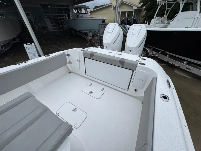 Slide: The Image of 2025 Cape Horn 32 XS boat interior with dual Mercury engines, showcasing spacious seating and storage. - 36