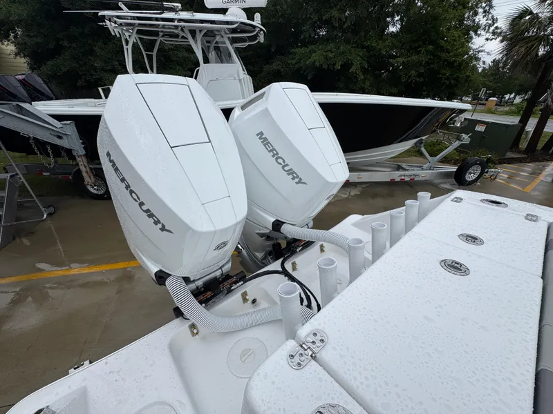 Slide: The Image of 2025 Cape Horn 32 XS boat with dual Mercury engines on a trailer. - 39