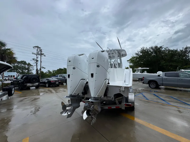 Slide: The Image of 2025 Cape Horn 32 XS boat with dual outboard engines on a trailer. - 12