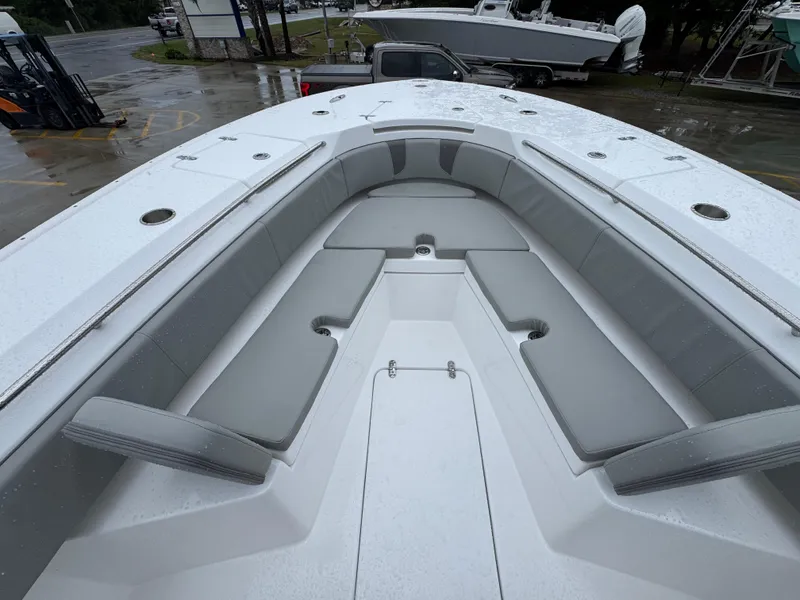 Slide: The Image of 2025 Cape Horn 32 XS boat with spacious seating and sleek design on a rainy day. - 18