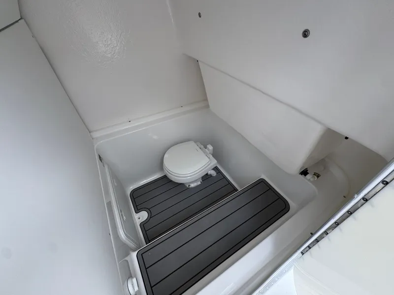 Slide: The Image of Interior of 2025 Cape Horn 32 XS boat bathroom with compact toilet. - 27