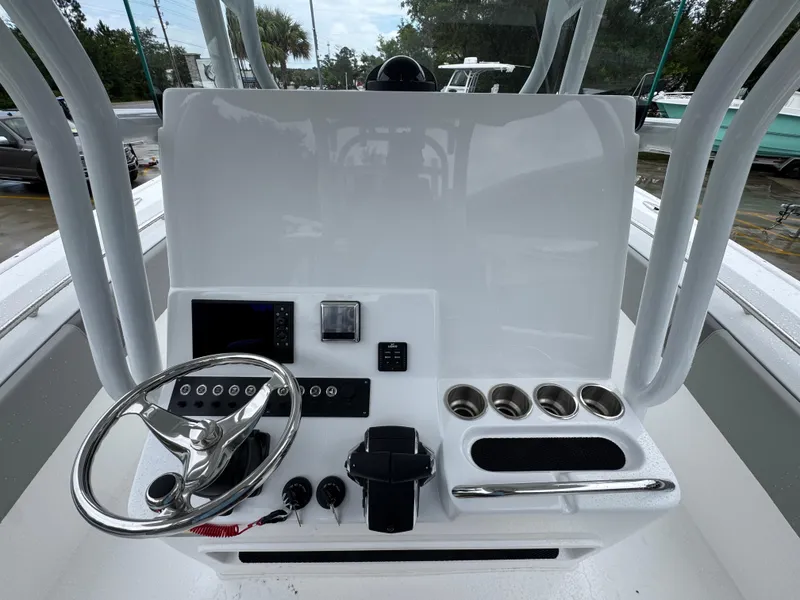 Slide: The Image of 2025 Cape Horn 32 XS boat console with steering wheel and control panel. - 29