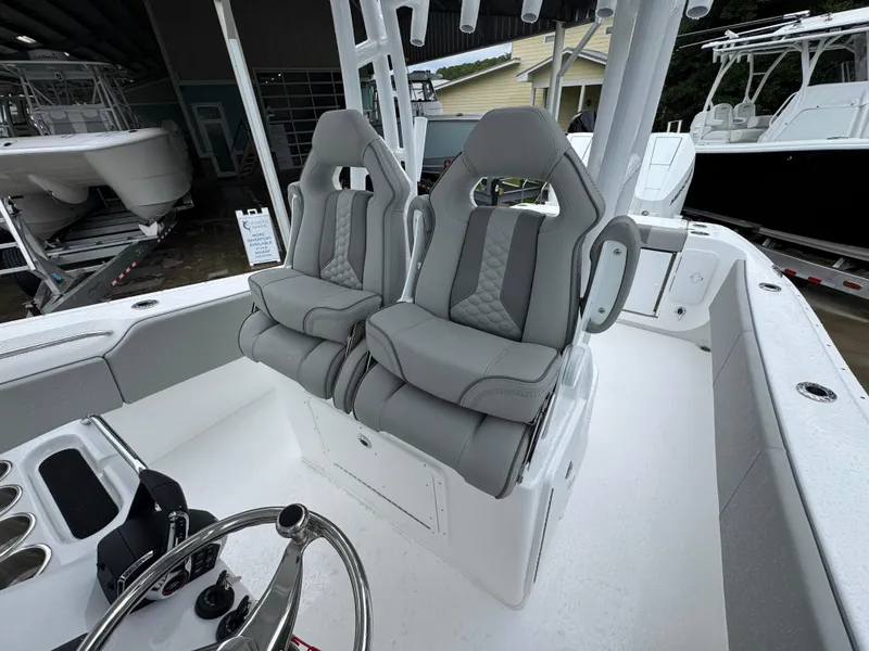 Slide: The Image of 2025 Cape Horn 32 XS boat interior with dual gray captain seats. - 31