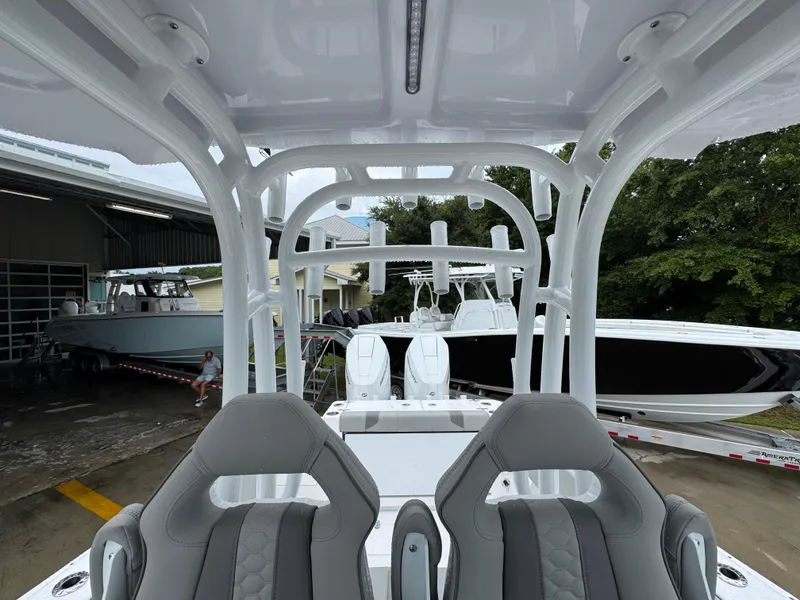 Slide: The Image of 2025 Cape Horn 32 XS boat interior with modern seating and sleek design. - 33