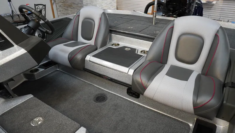 Slide: The Image of 2024 Ranger Z518 Ranger Cup boat interior with dual seats and steering console. - 11