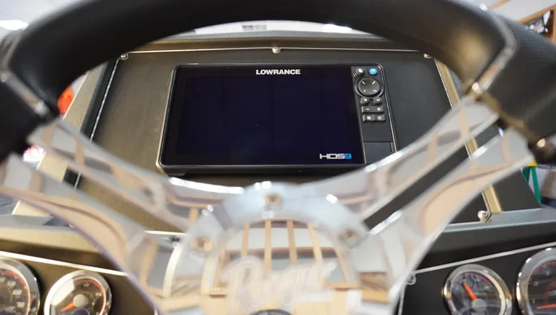 Slide: The Image of 2024 Ranger Z518 Ranger Cup dashboard with Lowrance HDS9 display and steering wheel. - 15