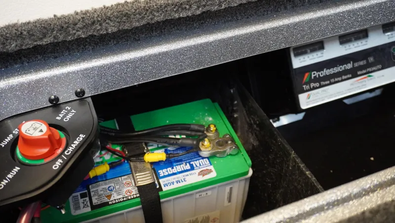 Slide: The Image of 2024 Ranger Z518 Ranger Cup Equipped boat battery compartment with charger and wiring. - 17