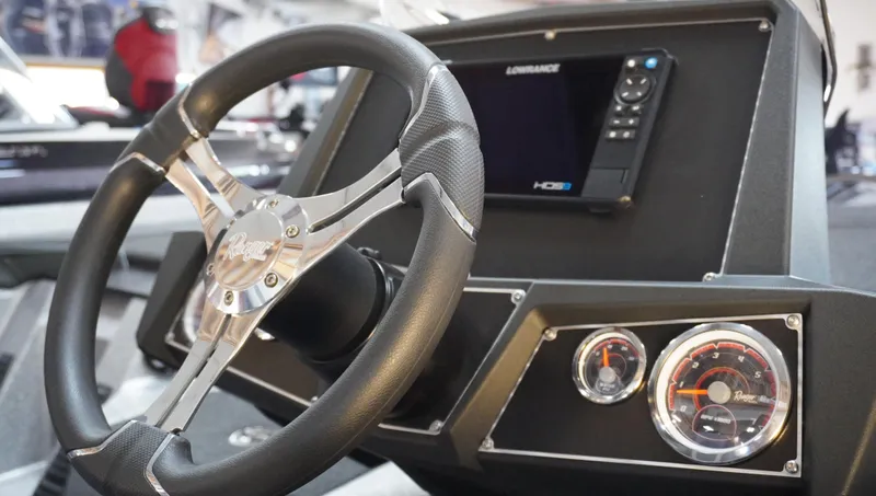 Slide: The Image of 2024 Ranger Z518 Ranger Cup dashboard with steering wheel, gauges, and Lowrance display. - 3