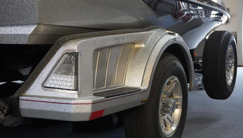 Slide: The Image of 2024 Ranger Z518 Ranger Cup Equipped trailer detail with metallic finish and wheel. - 6