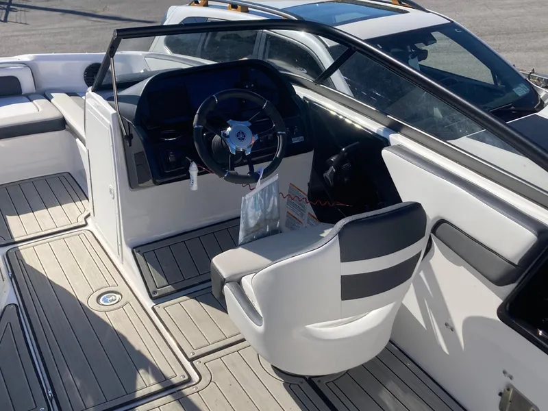 Slide: The Image of 2024 Yamaha Boats 195S cockpit with steering wheel and seating. - 7