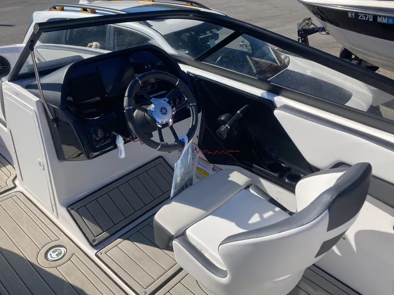 Slide: The Image of 2024 Yamaha Boats 195S cockpit with steering wheel and seating. - 9