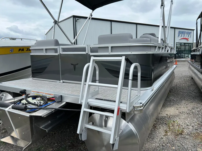 Slide: The Image of 2026 Tahoe Pontoon 2180 boat with sleek design and sturdy aluminum pontoons. - 6