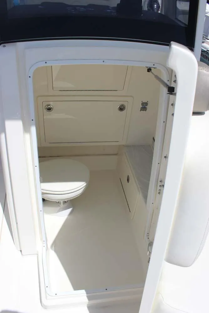Slide: The Image of 2023 World Cat 280 CC-X boat interior with compact marine toilet. - 14