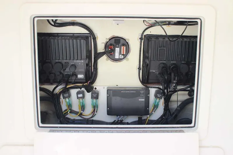Slide: The Image of Electrical panel of 2023 World Cat 280 CC-X boat, showcasing wiring and components. - 15
