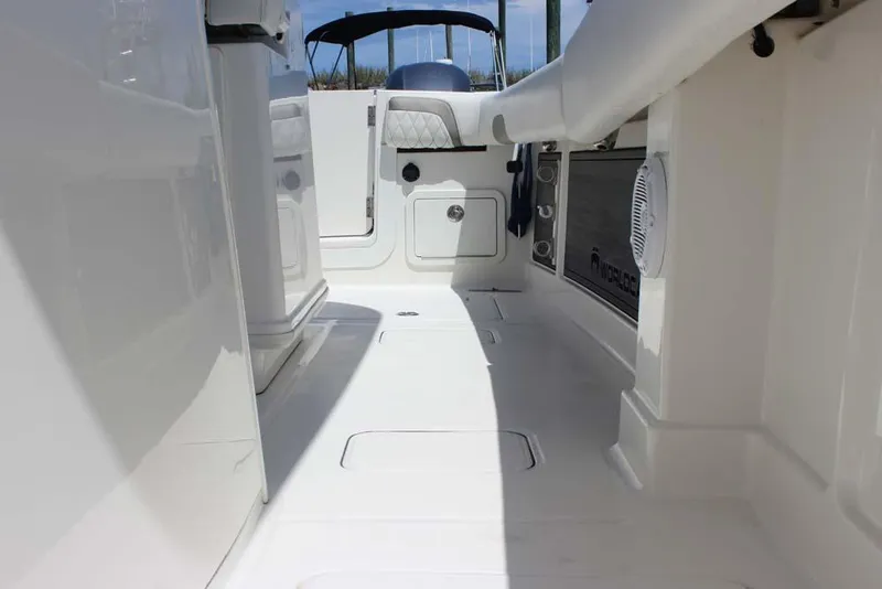 Slide: The Image of 2023 World Cat 280 CC-X boat interior, showcasing sleek white deck and seating area. - 18