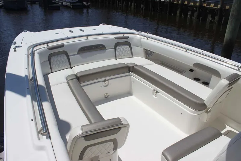Slide: The Image of 2023 World Cat 280 CC-X boat interior with cushioned seating and sleek design. - 3